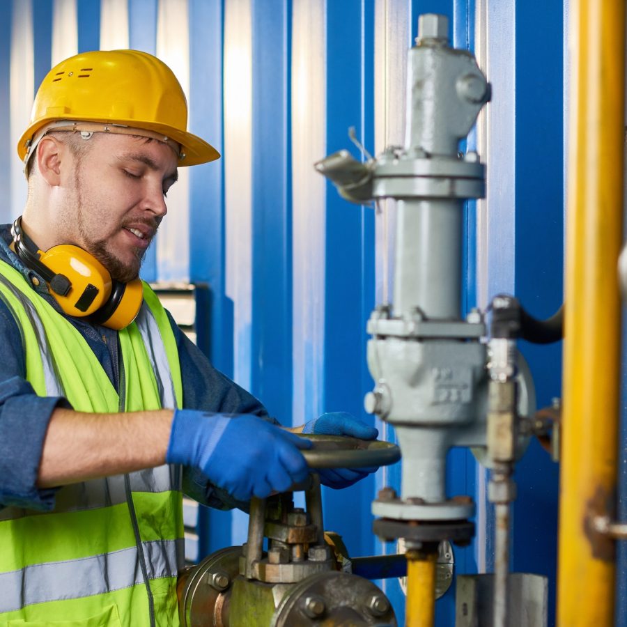 Young Plumber at Modern Plant